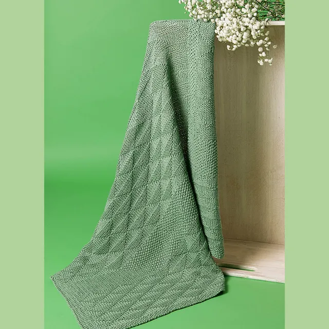 pascuali-nola-babydecke-strickanleitung-perlmuster-grafikmuster-6x-sole image 1