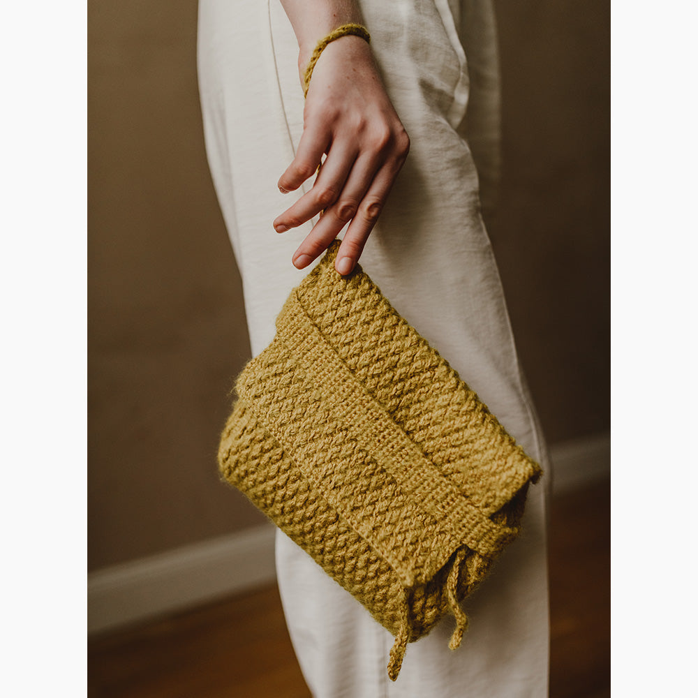 pascuali-h-kelanleitung-clutch-lunti-reliefmuster-aus-sole-manada image 1
